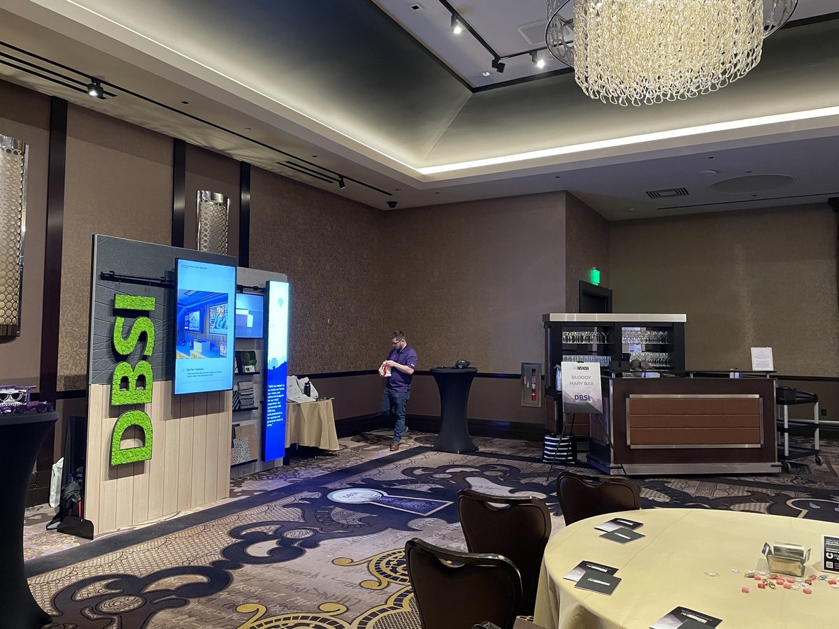 DBSI's CU relEVENT booth was equipped with digital signage screens, design examples, and living moss logo.